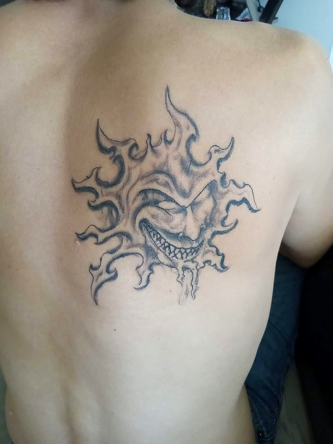 Tribal tattoo on Upper back