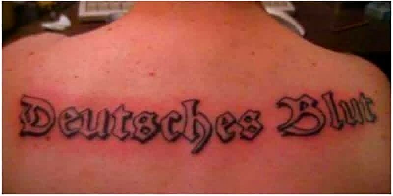 Lettering tattoo on Upper back