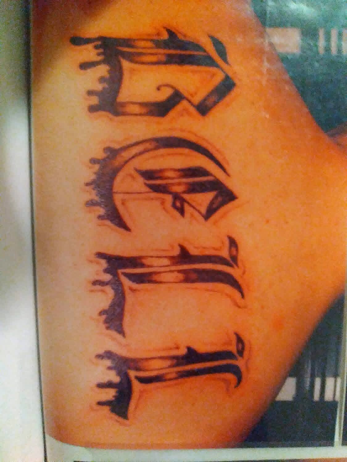 Lettering tattoo on Inner bicep