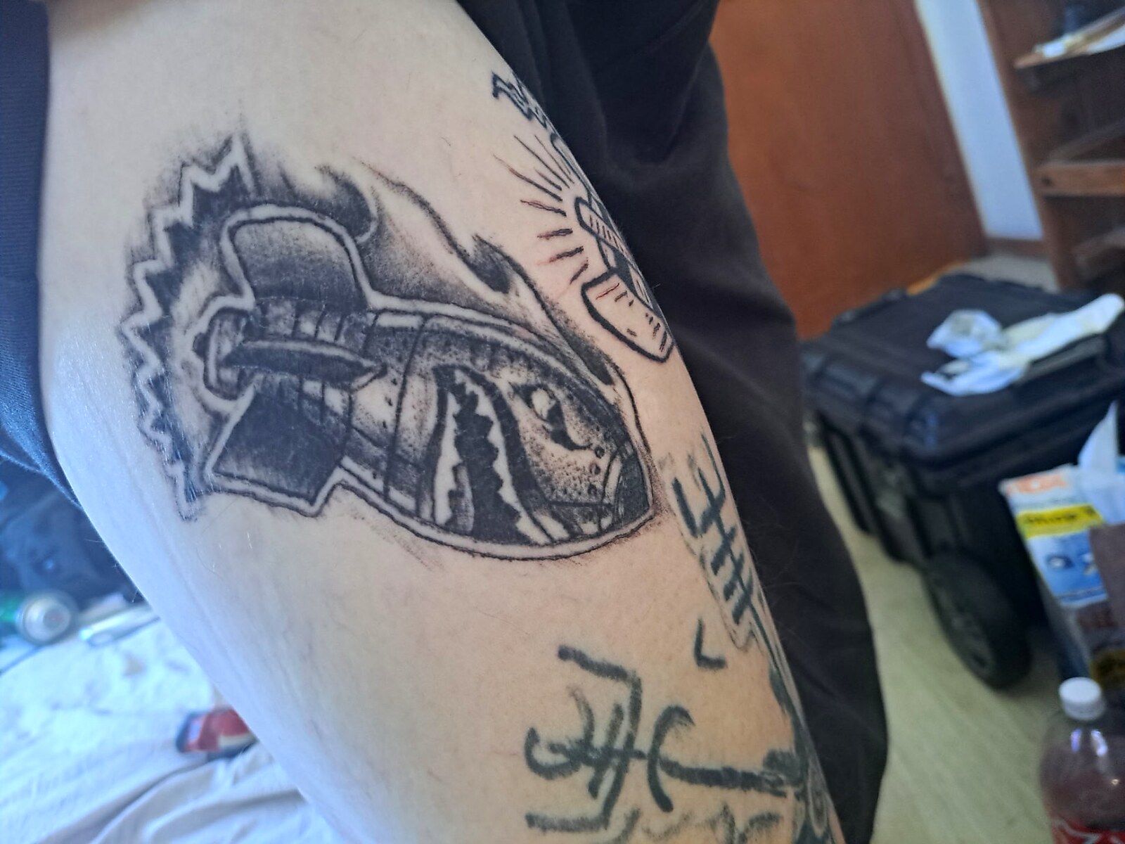 Custom Work tattoo on Bicep